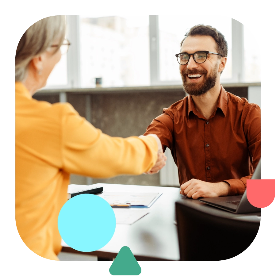 Rounded square shape with photo of people shaking hands.